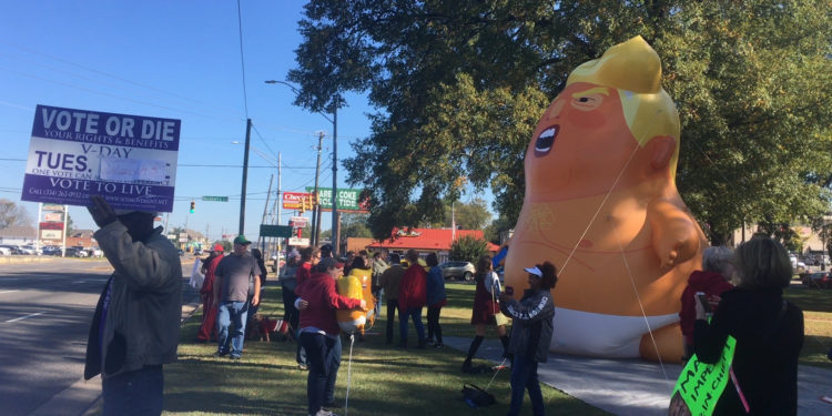 Trump’s visit to Alabama game sparks protests