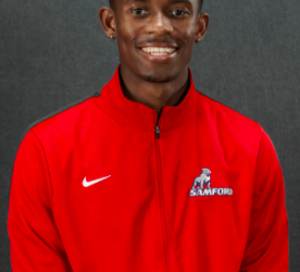 Justin Stuckey named All-American, honors late coach with record leap