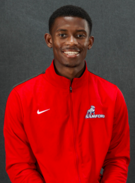 Justin Stuckey named All-American, honors late coach with record leap