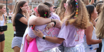 A Tri Delta member embraces her new sorority sister.