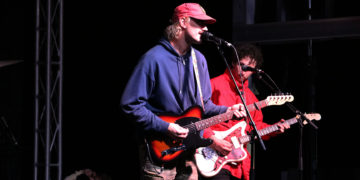 Baxter performs a song for the crowd.