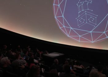 Planetarium audience learns about recent news in the world of astronomy.