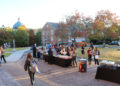 Students visit tables on Tailbird Circle for Fall Fest.