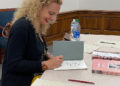 Brown signs books after her speaking engagement