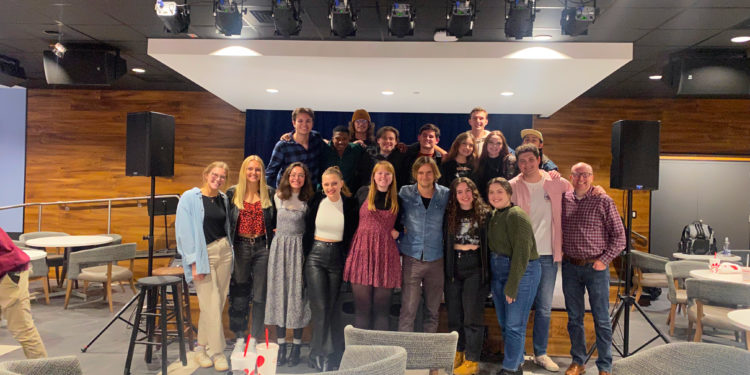 Students and professors gather at Harry's, excited to showcase original songs.