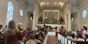 Visitors worshipping in Reid Chapel.