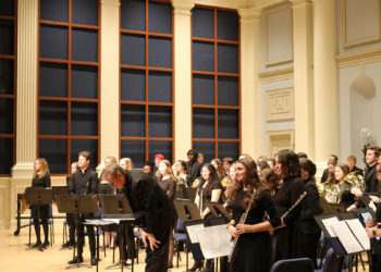 Jon Bubbett and the ensemble take in applause after their performance.