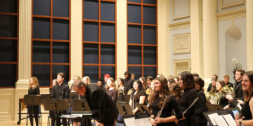 Jon Bubbett and the ensemble take in applause after their performance.