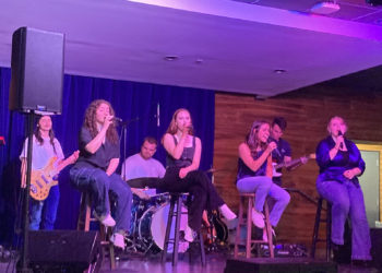 Student musicians lead the evening in song.
