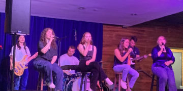 Student musicians lead the evening in song.