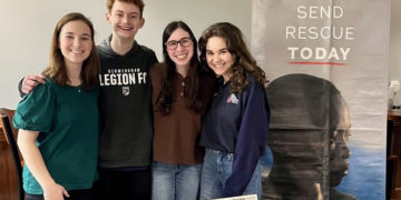 IJM members raise advocacy awareness at the event.