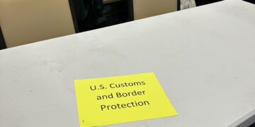 Samford students protest CBP presence at Job Fair